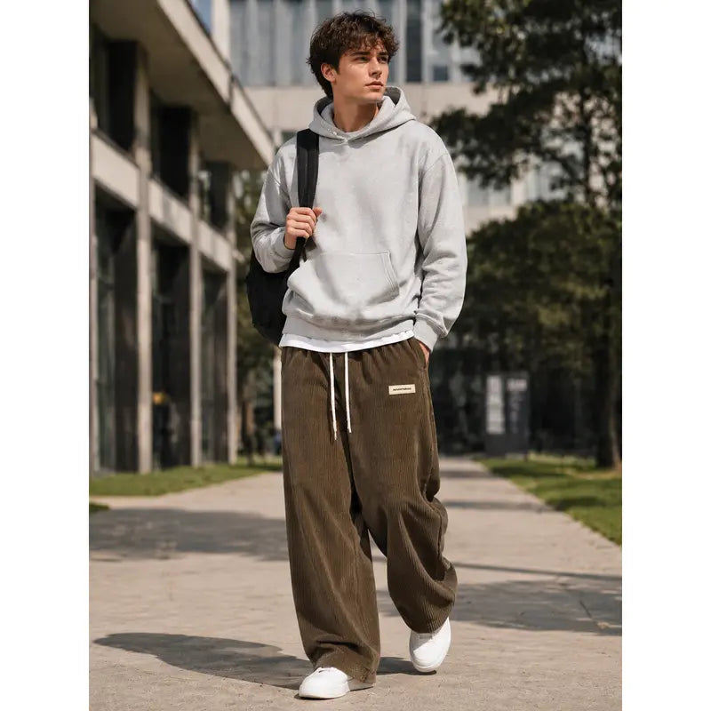 Men’s corduroy casual long pants for spring and autumn, elastic drawstring waist, loose straight fit, breathable and skin-friendly, comfortable everyday men’s trousers.